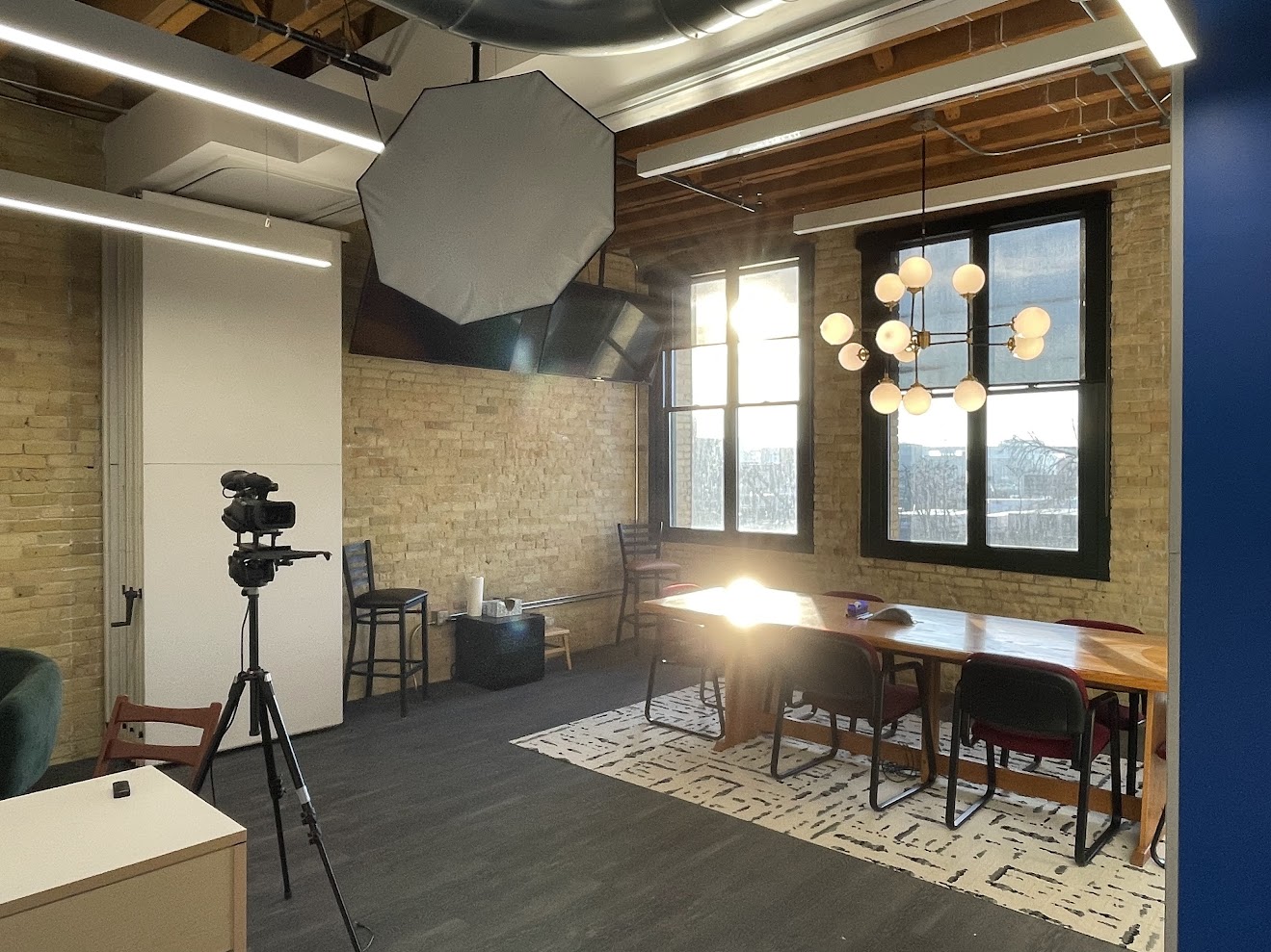 Audition room with lighting and camera setup near windows