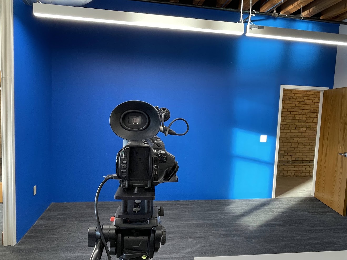Empty blue screen studio room with camera ready for auditions